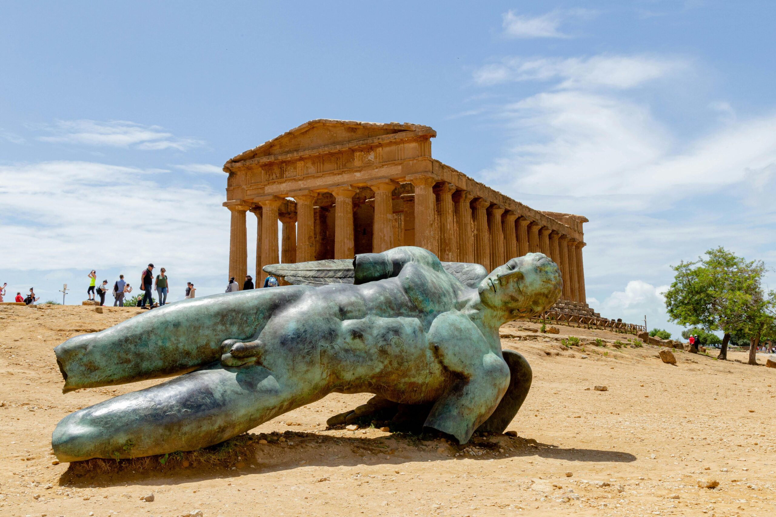 Ancient Greek Temple of Concordia and Icarus statue in Agrigento, Sicily. Historical and iconic architectural site.